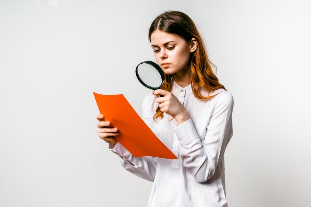 Professional inspecting schedule details closely — view and audit without a desktop P6 seat